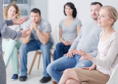Man talking with woman about problems during therapy for couples